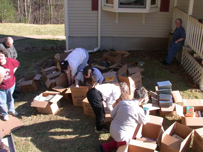 Sorting books (Someone's elbow, Priscilla Olson, Tony Lewis, Lisa Hertel, Sheila Perry, Elisabeth Carey, Suford Lewis, Pam Fremon)